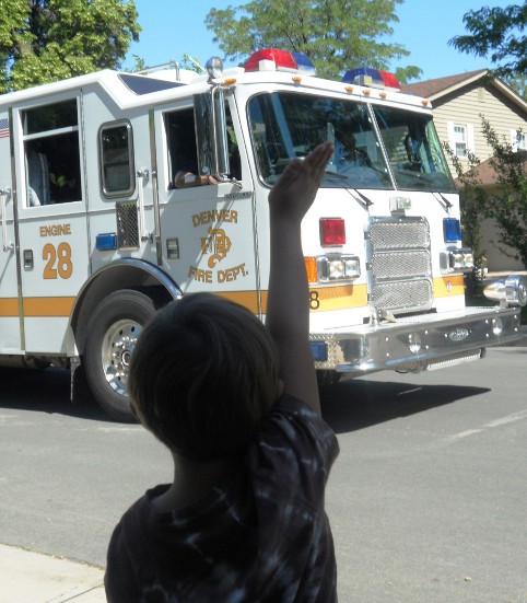 Oliver waving at the Firefighters
